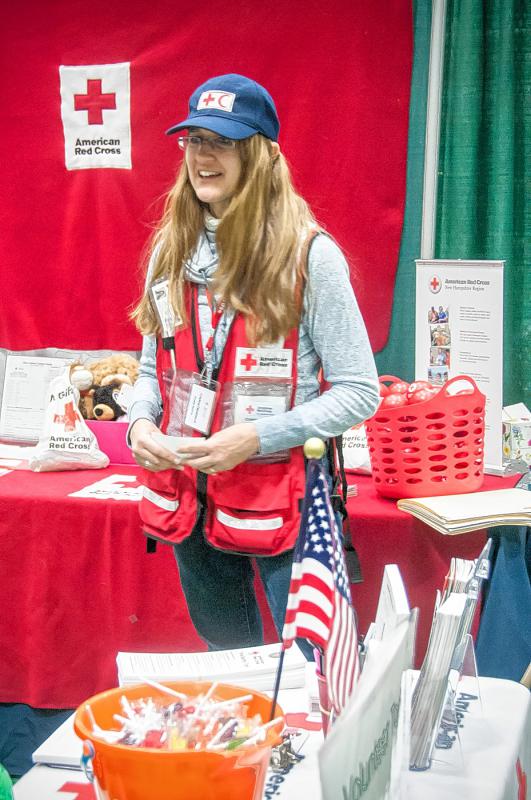 Christina Hammond, of Hanover, staffs the Upper Valley Red Cross display at the HomeLife Expo. Medora Hebert photograph -