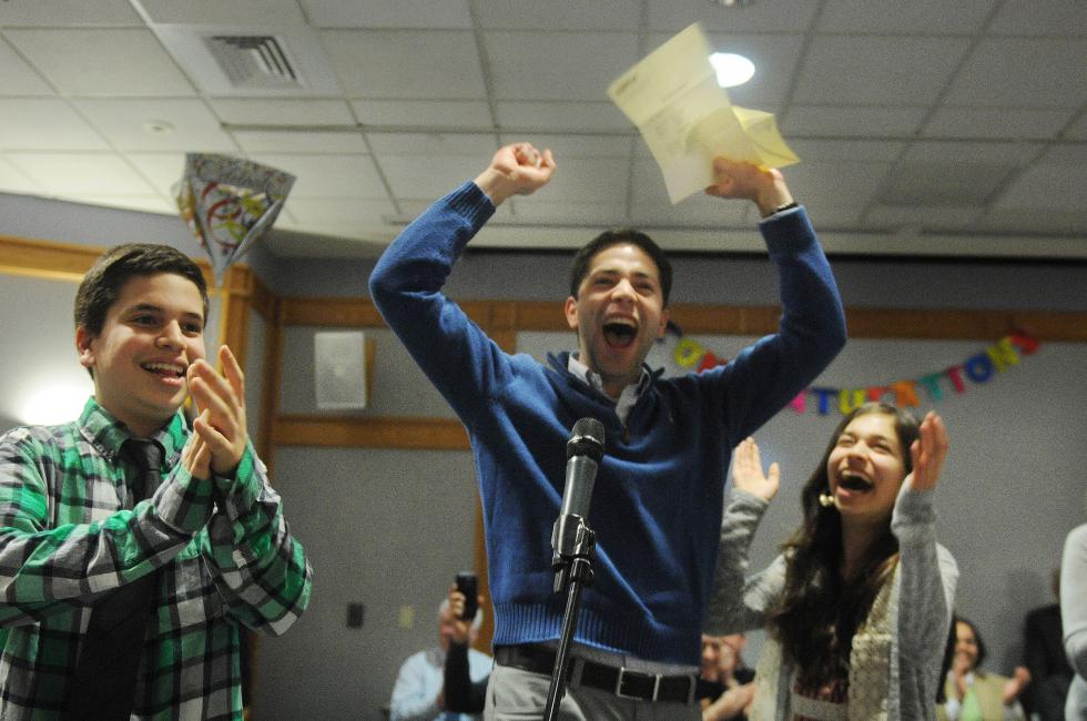 Geisel School of Medicine student Mazin Abdelghany celebrates after hearing his placement into an internal medicine program of his choice while his siblings, Hadi, 14, left, and Leena, 15, share in his excitement during the Geisel Match Day ceremony at Dartmouth-Hitchcock Medical Center in Lebanon, N.H., on March 20, 2015.  (Valley News - Sarah Priestap) Copyright © Valley News. May not be reprinted or used online without permission. Send requests to permission@vnews.com. - Sarah Priestap | Valley News