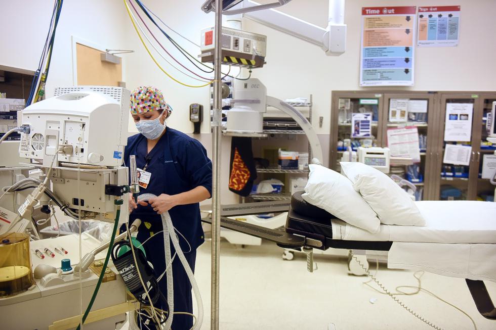 Melissa Masaracchia, anesthesiology/critical care resident, prepares an operating room for her on-call shift at Dartmouth-Hitchcock Medical Center in Lebanon, N.H., on March 25, 2015. Masaracchia, who is originally from New York City, said she's fallen in love with the Upper Valley and hopes to stay here after her residency and fellowship.  (Valley News - Sarah Priestap) Copyright © Valley News. May not be reprinted or used online without permission. Send requests to permission@vnews.com. - Sarah Priestap | Valley News