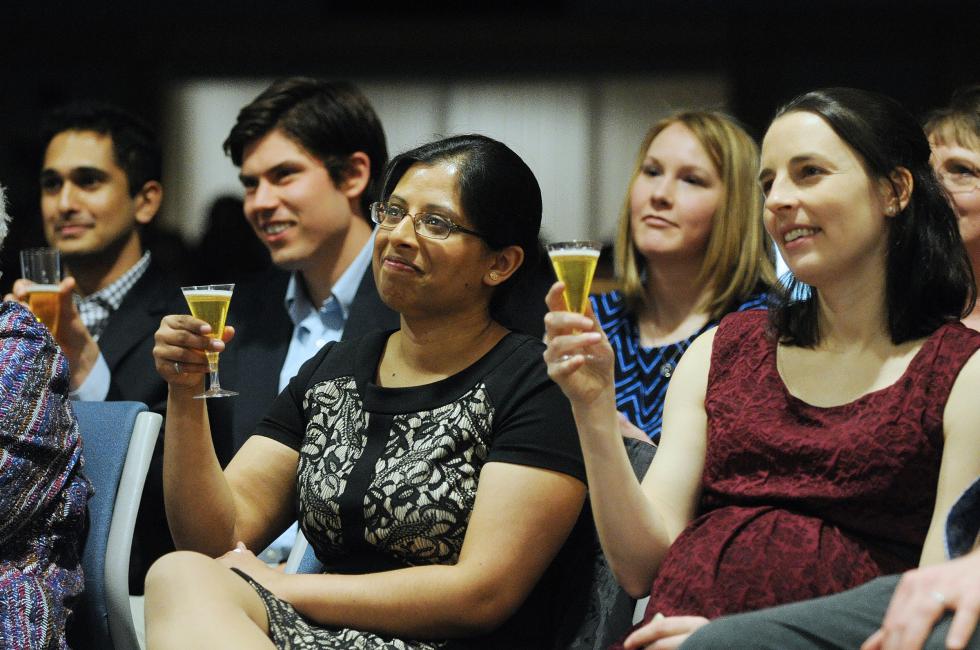 Geisel medical school students Swapna Sharma, left, and Kate Zeitler participate in a toast at the beginning of the Geisel Match Day ceremony at Dartmouth-Hitchcock Medical Center in Lebanon, N.H., on March 20, 2015.  (Valley News - Sarah Priestap) Copyright © Valley News. May not be reprinted or used online without permission. Send requests to permission@vnews.com. - Sarah Priestap | Valley News