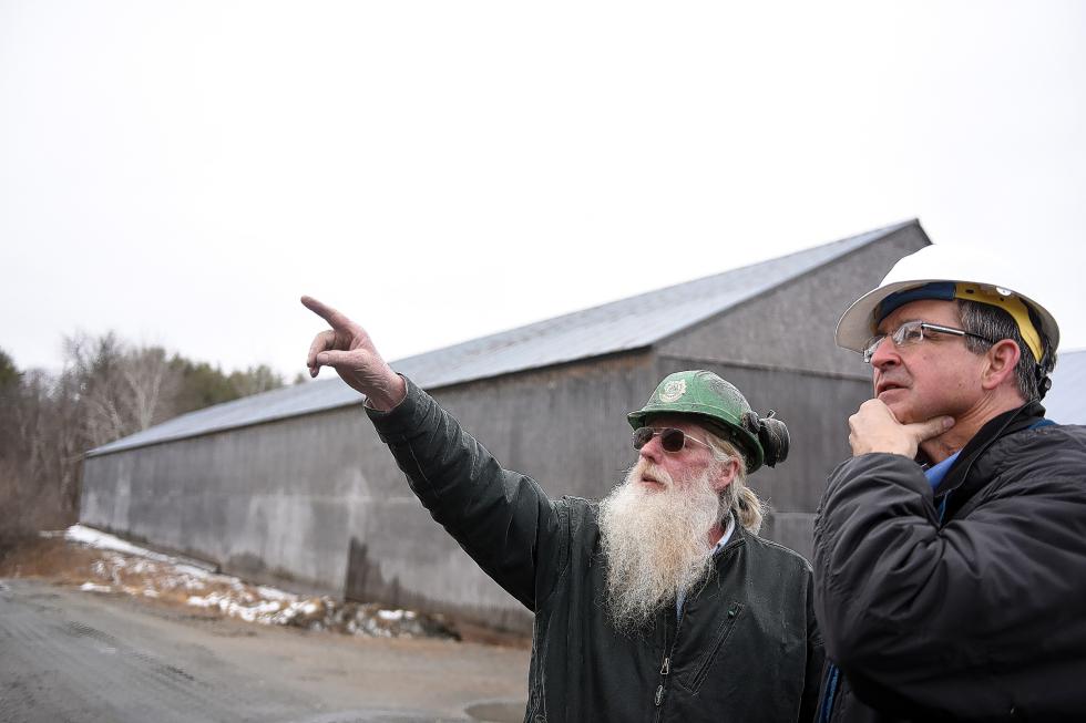 David Shepard, a sawyer at Britton Lumber Company in Fairlee, Vt., shows a storage building overhand he reconstructed to company President, Bob Moses on April 10, 2015. Shepard is one of several sawmill employees who is not being laid off, instead working in the company's wholesale department.  (Valley News - Sarah Priestap) Copyright © Valley News. May not be reprinted or used online without permission. Send requests to permission@vnews.com. - Sarah Priestap | Valley News