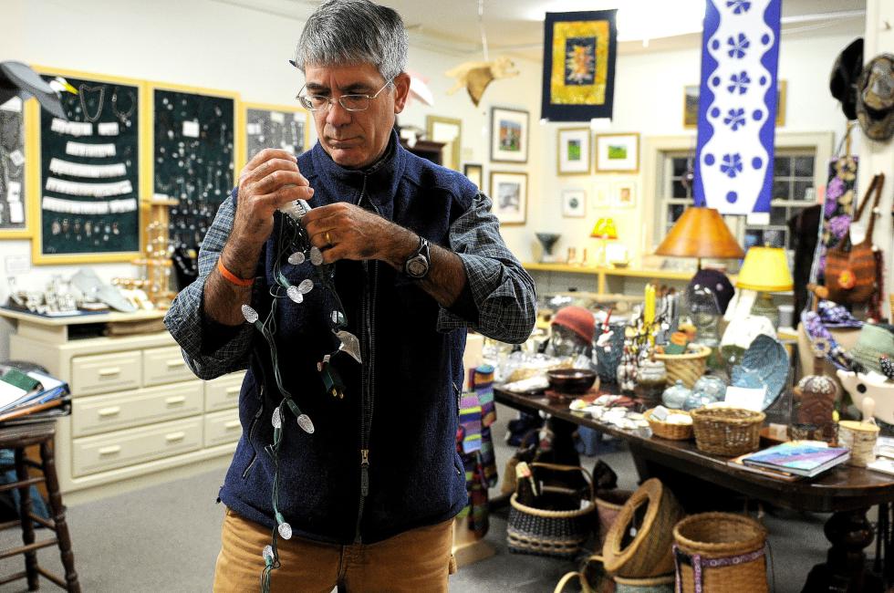 David Celone, of Long River Studios art gallery untangles a string of lights at the gallery in Lyme. N.H., on Nov., 17, 2014. ( Valley News - Jennifer Hauck)Copyright © Valley News. May not be reprinted or used online without permission. Send requests to permission@vnews.com. - Jennifer Hauck | Valley News