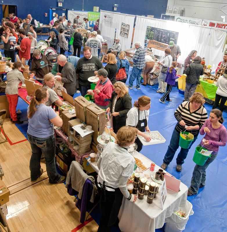 Attendees visit some of the booths at Flavors of the Valley in White River Junction, Vt. (Medora Hebert photograph) - 