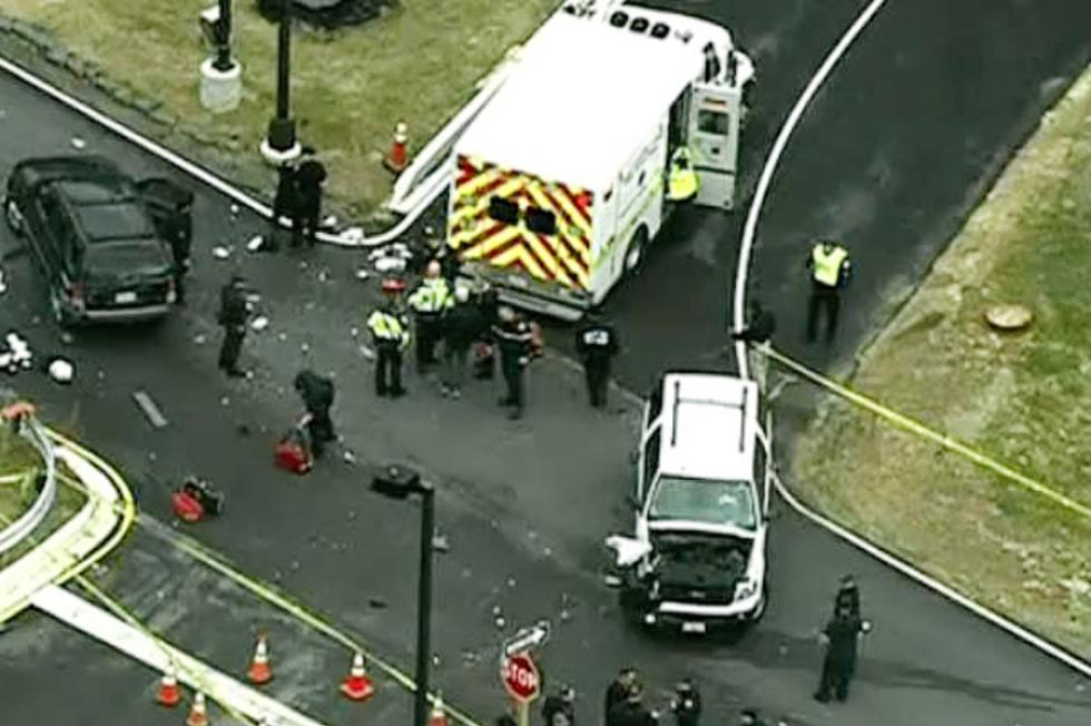 In this image made from video and released by WJLA-TV, authorities investigate the scene of a accident near a gate to Fort Meade, Md., on Monday, March 30, 2015. A spokesman at Fort Meade says two people are being treated for injuries at one of the gates of the sprawling Army installation near Baltimore. (AP Photo/WJLA-TV) MANDATORY CREDIT - WJLA-TV