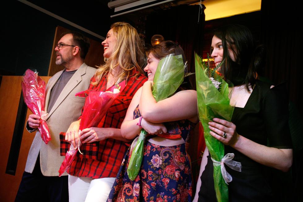 Local designers, from left, Mark Merrill, of White River Junction, Vt., Sigrid Lium, of White River Junction, Vt., Colleen McCleary, of Canaan, N.H., and Rene Garrior, of Lebanon, N.H., are honored with flowers and applause at the end of a fashion show held at the Main Street Museum in White River Junction, Vt.,  on April 4, 2015. (Valley News - Geoff Hansen) Copyright © Valley News. May not be reprinted or used online without permission. Send requests to permission@vnews.com. - Geoff Hansen | Valley News