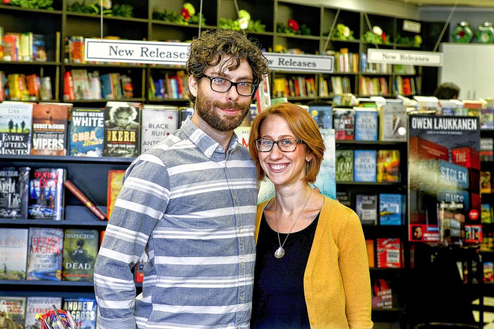 Trevor Thomas and Natalie Sacco pose for a portrait in the Mystery Lovers Bookstore in Oakmont, Pa. They moved back to the Pittsburgh area from Cleveland to buy the store. (Pittsburgh Post-Gazette - Robin Rombach) - Robin Rombach | Pittsburgh Post-Gazette