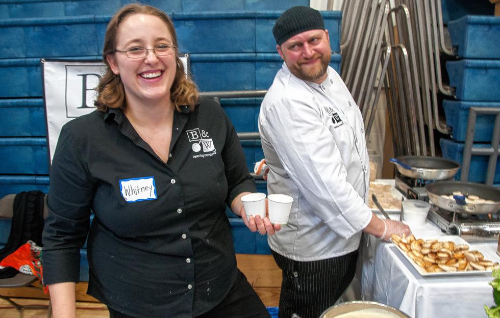 Whitney Battis and her husband Brent Battis treated visitors to pan seared sea scallops in cauliflower parsnip bisque. They are from B&W Catering based in Canaan, N.H. (Medora Hebert photograph) - 