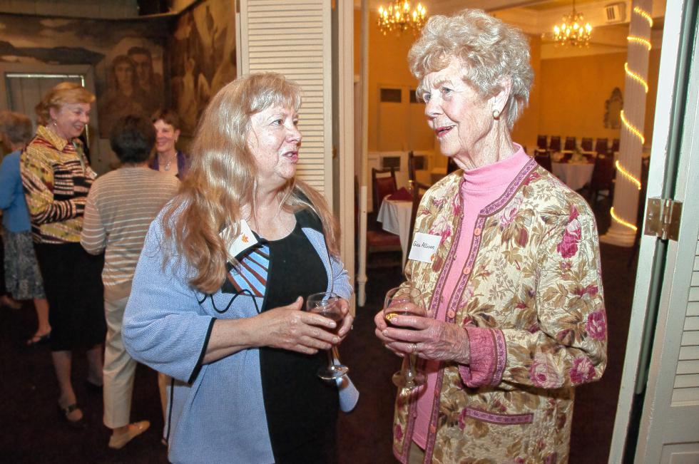 Judy Music, left, and Ginia Allison chat before the annual dinner of the Women’s Network of the Upper Valley, held at the Hotel Coolidge in White River Junction on May 19. Medora Hebert photograph -