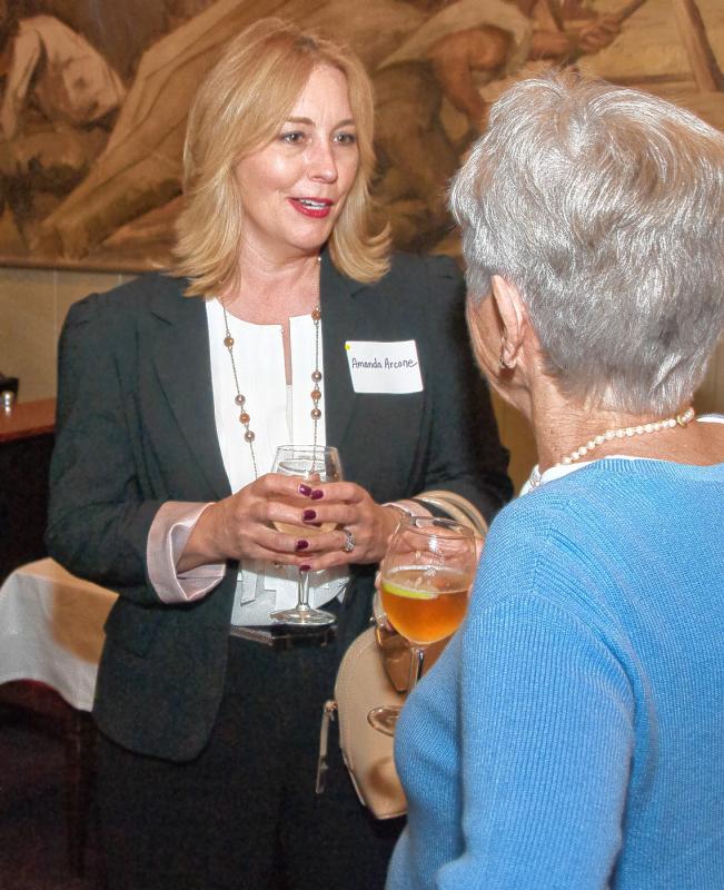 Amanda Arcone, left, chats with Molly Scheu during the annual dinner of the Women’s Network of the Upper Valley, held at the Hotel Coolidge in White River Junction on May 19. Medora Hebert photograph -