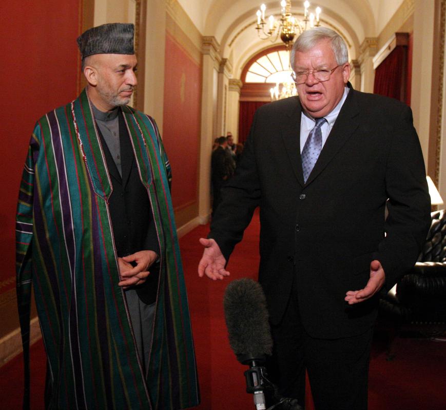 FILE - In this Sept. 26, 2006 file photo, Afghan President Hamid Karzai, left, meets with House Speaker Dennis Hastert of Ill. on Capitol Hill in Washington.  A newly unveiled indictment against Hastert released Thursday, May 28, 2015,  accuses the Republican of agreeing to pay $3.5 million in hush money to keep a person from the town where he was a longtime schoolteacher silent about "prior misconduct."  (AP Photo/Lauren Victoria Burke, File) - Lauren Victoria Burke | AP
