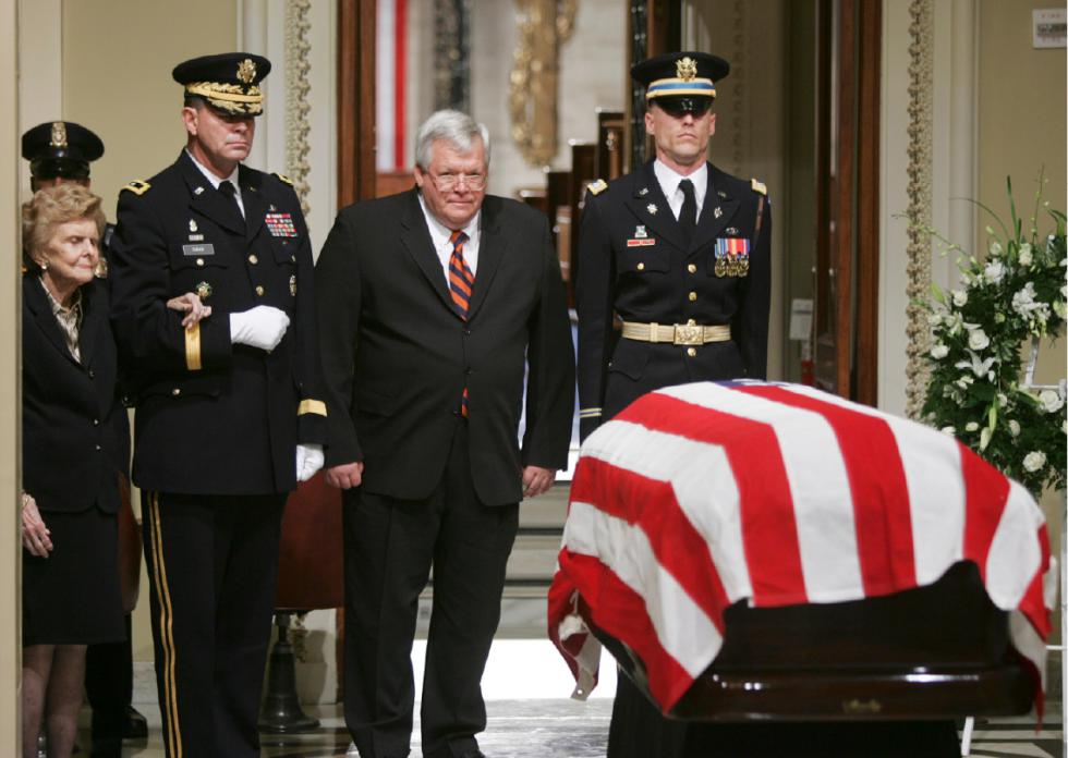 FILE - In this Dec. 30, 2006 file photo, House Speaker Dennis Hastert of Ill., center, walks past the casket of former President Gerald R. Ford on Capitol Hill in Washington. At left is former first lady Betty Ford, escorted by Maj. Gen. Guy Swan III. A newly unveiled indictment against Hastert released Thursday, May 28, 2015,  accuses the Republican of agreeing to pay $3.5 million in hush money to keep a person from the town where he was a longtime schoolteacher silent about "prior misconduct."   (AP Photo/Lawrence Jackson, Pool, File) - Lawrence Jackson | AP POOL