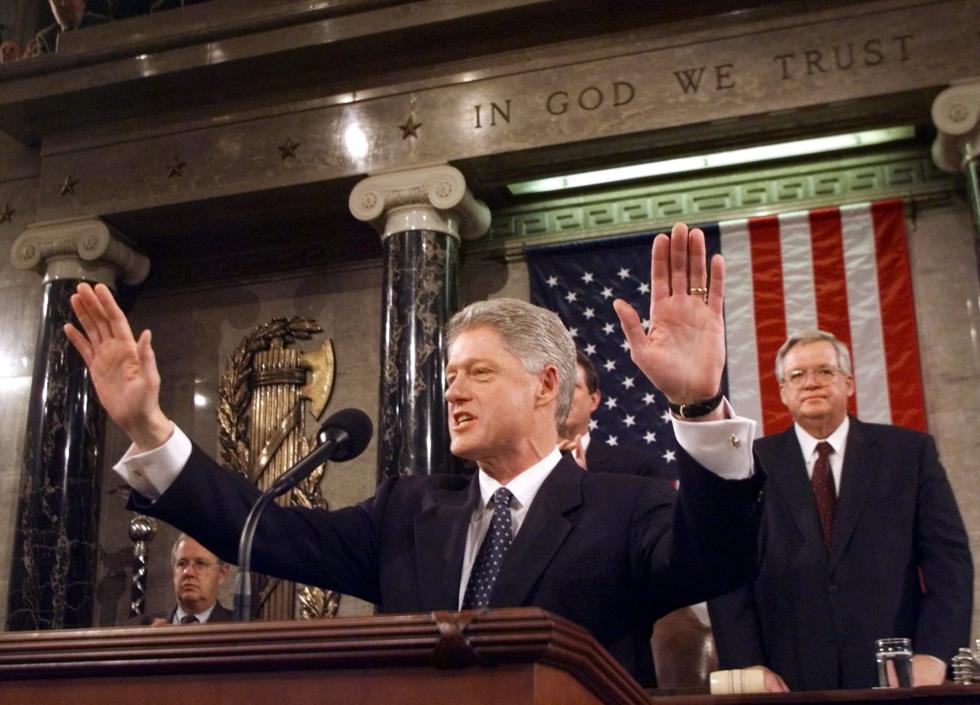 FILE - In this Jan. 19, 1999 file photo, President Clinton acknowledges the crowd prior to giving his State of the Union address on Capitol Hill . House Speaker Dennis Hastert of Illinois is at right.  A newly unveiled indictment against Hastert released Thursday, May 28, 2015,  accuses the Republican of agreeing to pay $3.5 million in hush money to keep a person from the town where he was a longtime schoolteacher silent about "prior misconduct."  (AP Photo/Win McNamee, Pool, File) - Win McNamee | POOL