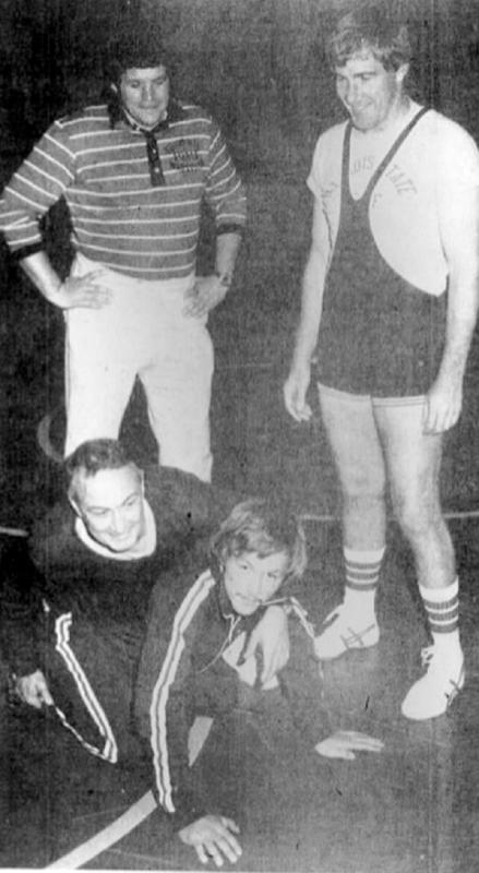 FILE-In this Oct. 25, 1975 Yorkville, Ill., high school wrestling coach and former House Speaker Dennis Hastert, top left, and Illinois State University wrestling coach Larry Meyer, top right, watch as University High School coach George Girardi, bottom left, demonstrates a move on Yorkville assistant Tony Houle at a technical wrestling clinic in Bloomington, Ill. (The Pantagraph via The AP) - The Pantagraph | The Pantagraph