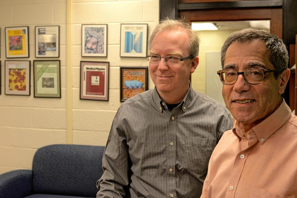 University of Pennsylvania physicists Charles Kane, left, and Eugene Mele, right, pose in their office on April 16, 2015 in Philadelphia, Pa. They've introduced a new class of materials known as topological insulators that in addition to allowing the production of electronic devices with better efficiency (and less heat in your laptop computer), also are expected to be useful in the creation of superfast "quantum" computers. (Tom Gralish/Philadelphia Inquirer/TNS) - Tom Gralish | Philadelphia Inquirer