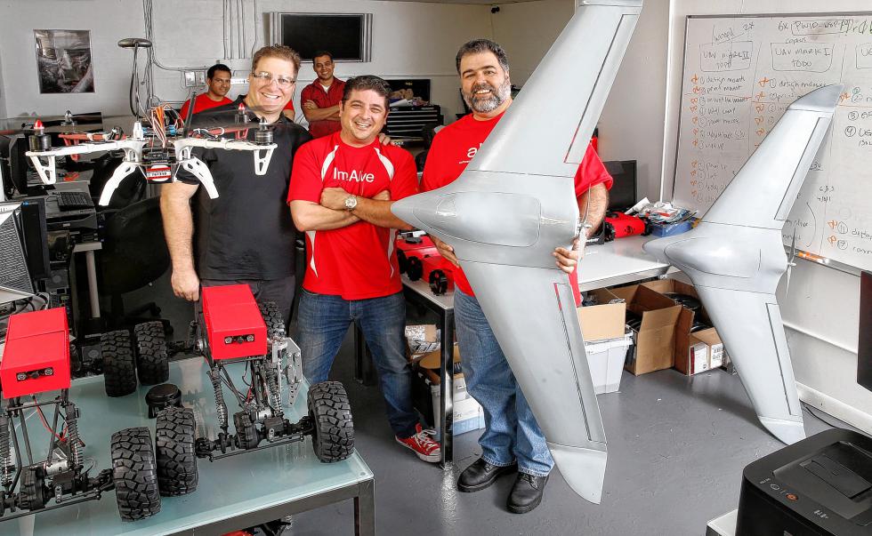 Steven McKean, Daniel Rodriguez and Jorge Puignau are pictured on Tuesday, April 14, 2015, at Animusoft, a young technology company that is building an operating system for drones in Miami. (Al Diaz/Miami Herald/TNS) - Al Diaz | Miami Herald