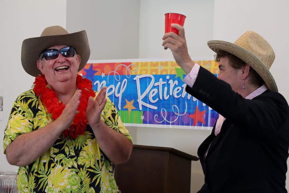 Lebanon City Mayor Georgia Tuttle, right, raises her cup to toast Lebanon City Manager Greg Lewis during his retirement party at Kilton Library in West Lebanon, N.H., on June 24, 2015. Numerous public officials from Lebanon and surrounding towns attended the celebration to honor Lewis, who has served as Lebanon City Manager since February 2011. (Valley News - Sarah Shaw) <p><i>Copyright © Valley News. May not be reprinted or used online without permission. Send requests to permission@vnews.com.</i></p> - Sarah Shaw  | Valley News