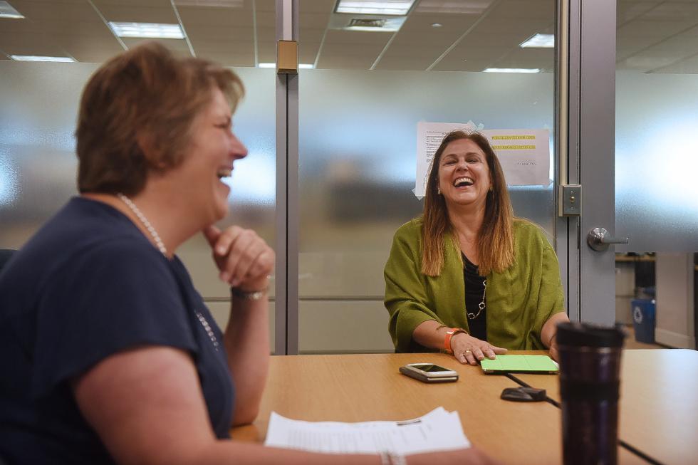 Secretery of Commerce, Pat Moulton, left, shares a laugh with Vermont Commissioner of Economic Development, Joan Goldstein, of Randolph, Vt., while they both interview a job candidate in the National Life Building in Montpelier, Vt., on June 17, 2015.  (Valley News - Sarah Priestap) <p><i>Copyright © Valley News. May not be reprinted or used online without permission. Send requests to permission@vnews.com.</i></p> - Sarah Priestap | Valley News