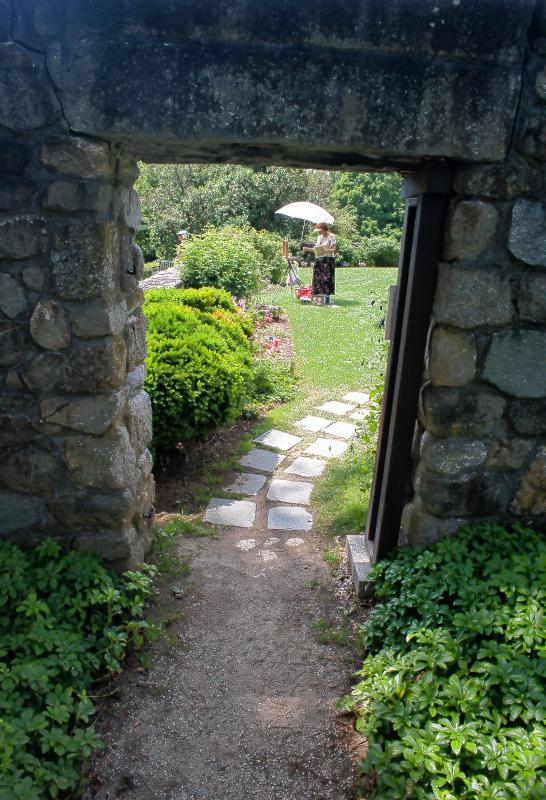 A path leads though a stone wall into the garden at The Fells during the annual artists weekend at The Fells in Newbury, N.H.  Medora Hebert  7-19-2015 - 