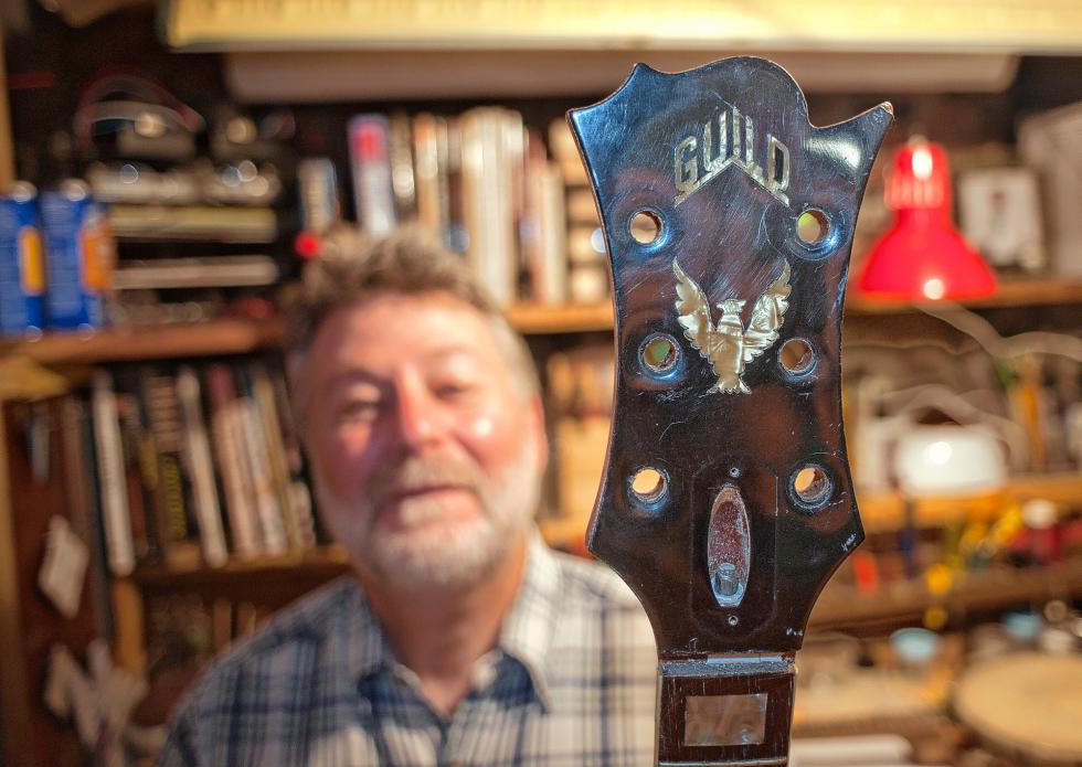 Will Morneault and the  Gumby Head on a vintage guitar.  Medora Hebert photograph - 