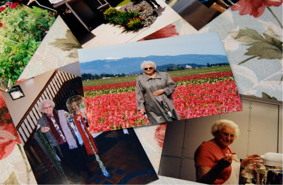 This July 1, 2015 photo shows photos of Roslyn Duffy's late mother, Evelyn Nappa, at Duffy's home in Seattle. Duffy had to scramble to find a home willing to take Medicaid payments after her mother was evicted from a Seattle assisted-living facility. The stress and the change of surroundings strained her mother's health, Duffy said, and six weeks after moving, she was dead. (AP Photo/Ted S. Warren) - Ted S. Warren | AP