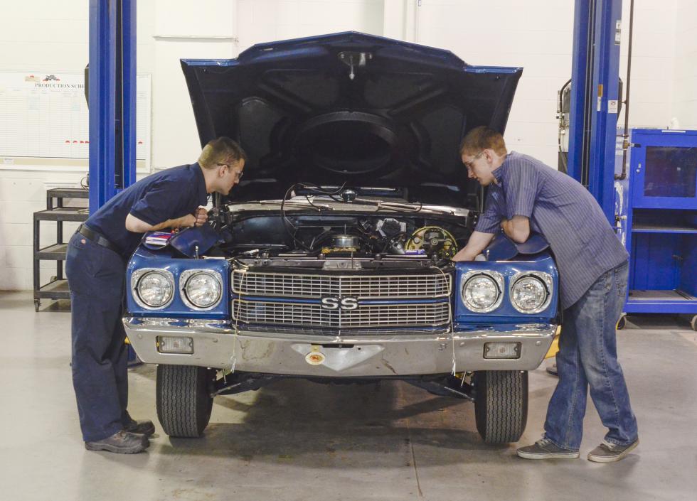 In this March 26, 2015, photo, Jay Rhoads, left, and Patrick Stephens inspect recent work on a 1970 Chevrolet Chevelle SS at Pennsylvania College of Technology in Williamsport, Pa. (AP Photo/Ralph Wilson) - Ralph Wilson | FR78134 AP
