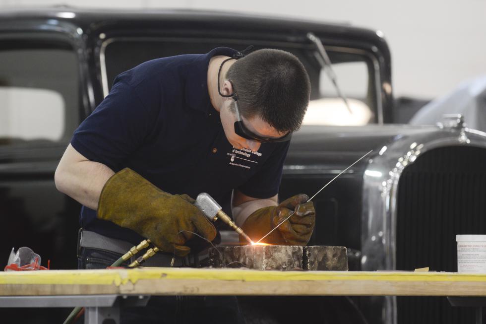 In this March 26, 2015, photo, Sean Hunter tests gas welds on aluminum while working on a 1935 Rolls Royce at Pennsylvania College of Technology in Williamsport, Pa. When Penn College of Technology revved up its vintage vehicle restoration major in 2012, it became one of just a handful of degree programs around the country teaching teens and 20-somethings how to help refurbish and maintain North Americas fleet of more than 10 million classic cars. (AP Photo/Ralph Wilson) - Ralph Wilson | FR78134 AP