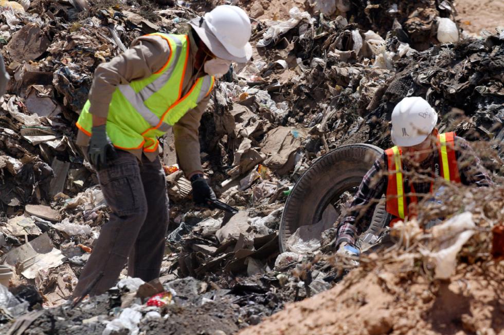 FILE - In this April 26, 2014 file photo, workers sift through trash in search for decades-old Atari 'E.T. the Extra-Terrestrial' game cartridges in Alamogordo, N.M.   A cache of Atari game cartridges dug up in an Alamogordo landfill last year has generated more than $100,000 in sales.  An estimated 850 games that sold on eBay over the last several months in 2015 brought in close to $108,000.  (AP Photo/Juan Carlos Llorca, File) - Juan Carlos Llorca | AP
