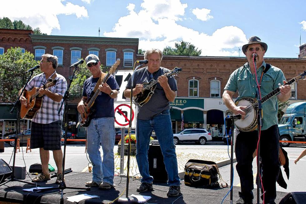 Michael Wood on guitar, Pooh Sprague on bass, Kenny Norstrant on mandolin and Steve Henning on banjo provide musical entertainment at The Taste of Woodstock festival on Aug. 8. Nancy Nutile-McMenemy photograph -