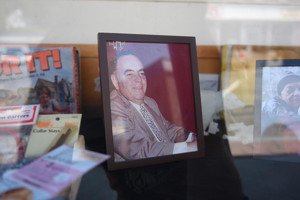 A photograph of co-founder Edward Wendell Sr. sits in the front window display of the Hill's 5 & 10 store in Bradford, Vt., on August 14, 2015.  (Valley News - Sarah Priestap) <p><i>Copyright © Valley News. May not be reprinted or used online without permission. Send requests to permission@vnews.com.</i></p> - Sarah Priestap | Valley News