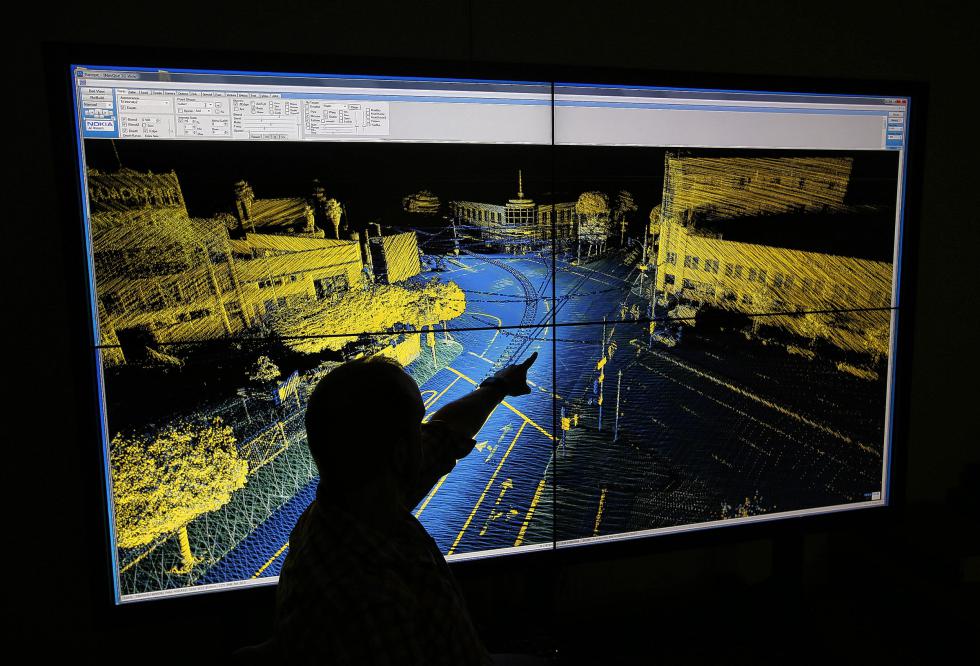 John Ristevski, vice president, reality capture and processing for HERE, a Nokia company, shows a map of the Bay Bridge with lidar intensity values at their headquarters in Berkeley, Calif., on Friday, July 17, 2015. The company operates a global fleet of vehicles equipped with radars, lasers and cameras capturing 3-D street images to make detailed maps that will be needed for the future when cars drive themselves. (Jane Tyska/Bay Area News Group/TNS) - JANE TYSKA | San Jose Mercury News