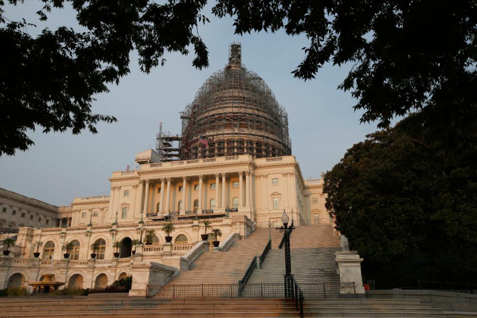 The west front of the U.S. Capitol is seen under repair Sept. 2, 2015 in Washington. Congress returns on Sept. 8 with a critical need for a characteristic that has been rare through a contentious spring and summer _ cooperation between Republicans and President Barack Obama. Lawmakers face a weighty list of unfinished business and looming deadlines, with a stopgap spending bill to keep the government open on Oct. 1 paramount. (AP Photo/Alex Brandon) - Alex Brandon | AP