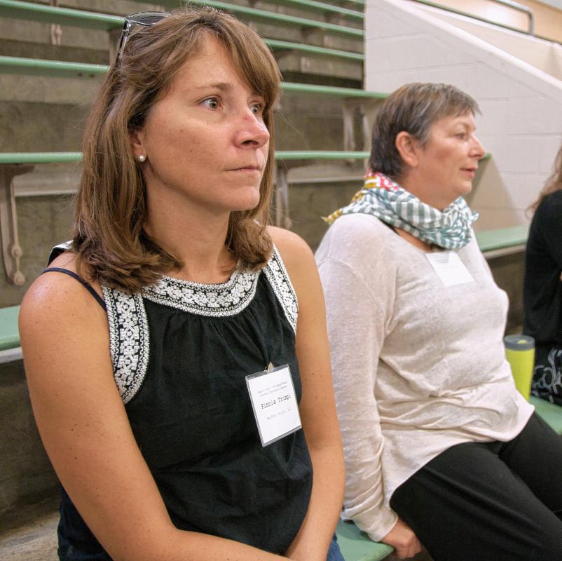 Finnie Trimpi, of South Pomfret, left, and Jill Davies, of Woodstock,  listen to speakers at last month's Women’s Economic Opportunity  Conference at Vermont Technical College. Medora Hebert photograph - 