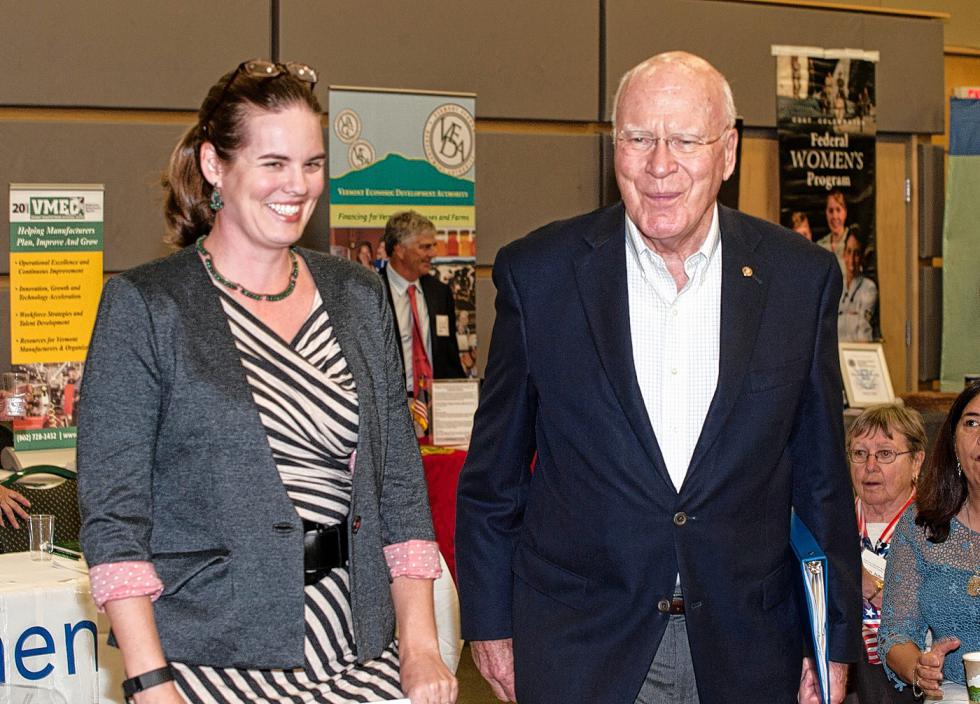 Keynote speaker Jane Lindholm, host of Vermont Edition on Vermont  Public Radio and U.S. Sen. Patrick Leahy, D-Vt., make their way to the  lecturn before last month's Women’s Economic Opportunity Conference  at Vermont Technical College. Medora Hebert photograph - 