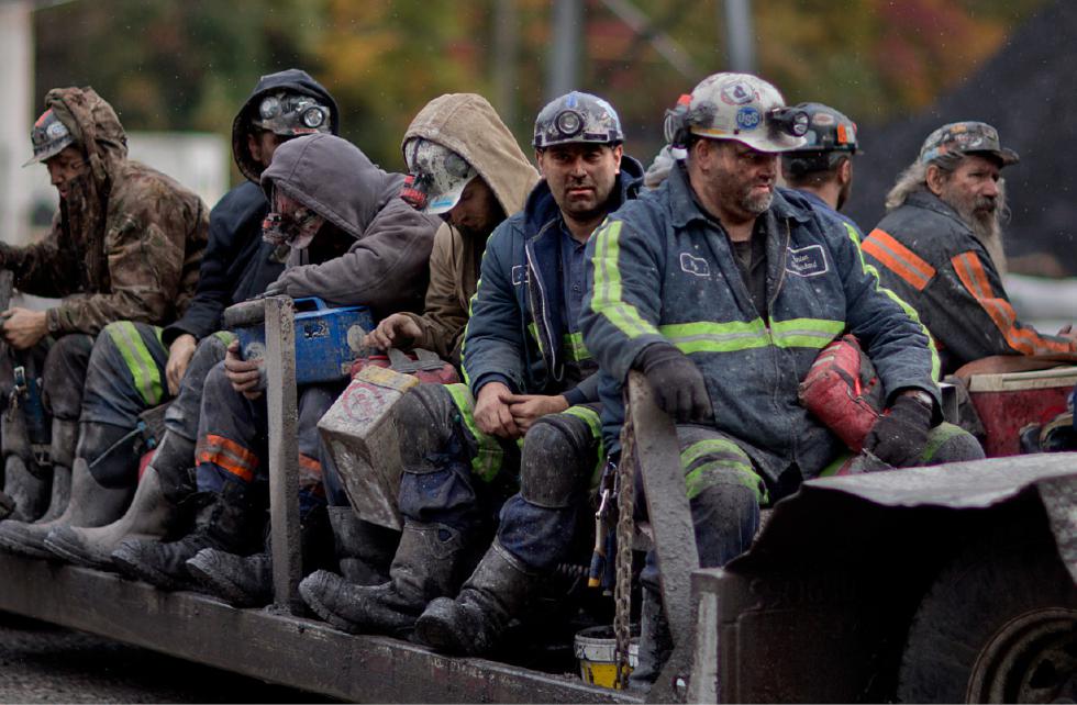 FILE - In this Oct. 15, 2014 photo, coal miners return on a buggy after working a shift underground at the Perkins Branch Coal Mine in Cumberland, Ky. As recently as the late 1970s, there were more than 350 mines operating at any given time in Harlan County. In 2014, it's around 40. (AP Photo/David Goldman, File) - David Goldman | AP