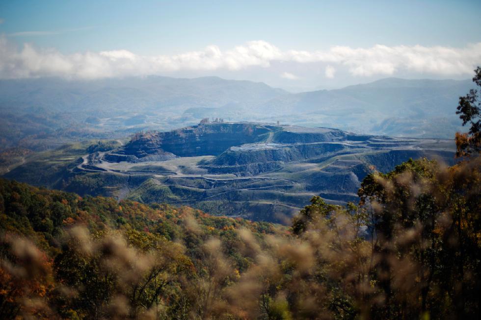 FILE - This Oct. 17, 2014 file photo made from Black Mountain in Lynch, Ky., shows an unreclaimed strip mine in Virginia, just across the state line from Kentucky's Harlan County. Kentucky coal miners bled and died to unionize. The union era's death knell sounded in Kentucky on Dec. 31, 2014, when Patriot Coal announced the closing of its Highland Mine. (AP Photo/David Goldman, File) - David Goldman | AP