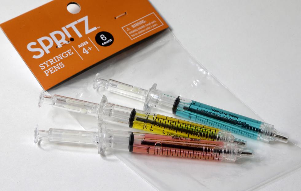 In this Wednesday, Oct. 14, 2015 photo pens that look like syringes are displayed with their packaging in Boston. The pens are being sold as Halloween novelty toys at Target stores and some online retailers. (AP Photo/Steven Senne) - Steven Senne | AP