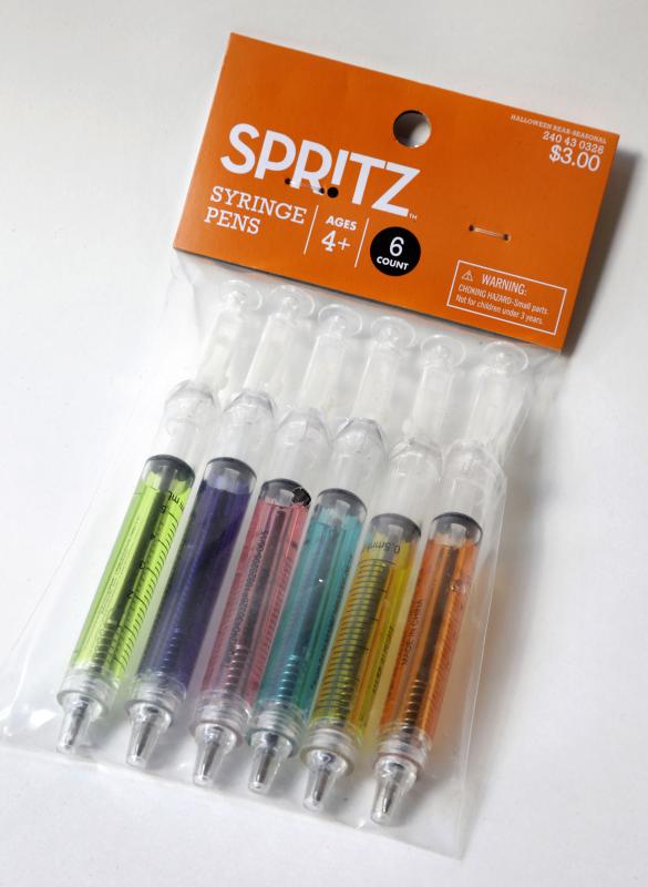 In this Wednesday, Oct. 14, 2015, photo, pens that look like syringes are displayed in their packaging in Boston. The pens are being sold as Halloween novelty toys at Target stores and some online retailers. (AP Photo/Steven Senne) - Steven Senne | AP