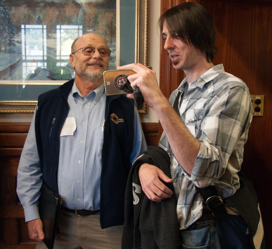Gerry Hawkes of Woodstock, left, and Tony Bacon of Brattleboro share information.  Hawkes is an inventor and Bacon is a documentary film maker.  10-16-2015 Medora Hebert - 