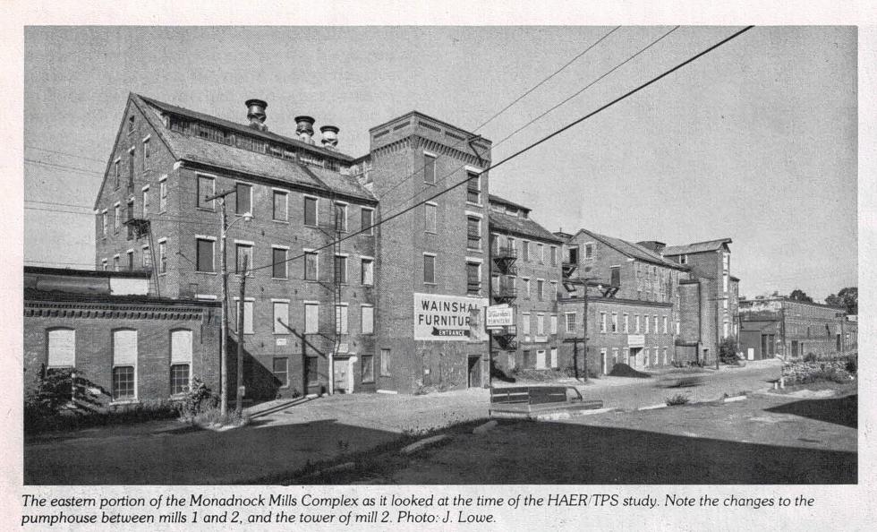 The Wainshal building (Mill No. 2) as it appeared in 1978. It was built in 1853 as part of the Monadnock Mills complex, which closed in 1932. To the left is the two-story Monadnock Mills Wheel and Pump House, built in 1874, which later housed Claremont Water Works. To the right is the one-story Monadnock Mills Weave Shed, built in 1876, which became Shulins Woolen Co. The image  comes from "Rehabilitation: Claremont 1978, Planning for Adaptive Use and Energy Conservation in an Historic Mill Village," issued by the Heritage Conservation and Recreation Services of the U.S. Department of the Interior. (Courtesy of Claremont Historical Society) -