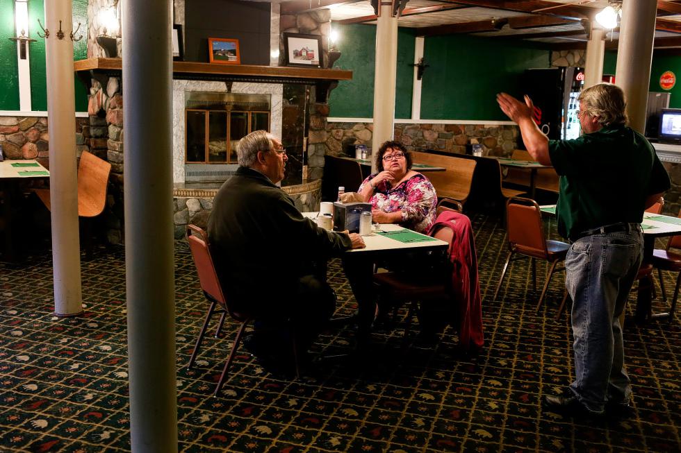 Green Mountain Diner owner Ed Morrison gives Joseph and Susan Stopero, of Cohoes, N.Y., suggestions for sites to see on their return home after eating breakfast at the Bradford, Vt., eatery on October 9, 2015. They had been on vacation in Maine and stopped for the night in Bradford. (Valley News - Geoff Hansen) <p><i>Copyright Â© Valley News. May not be reprinted or used online without permission. Send requests to permission@vnews.com.</i></p> - Geoff Hansen | Valley News
