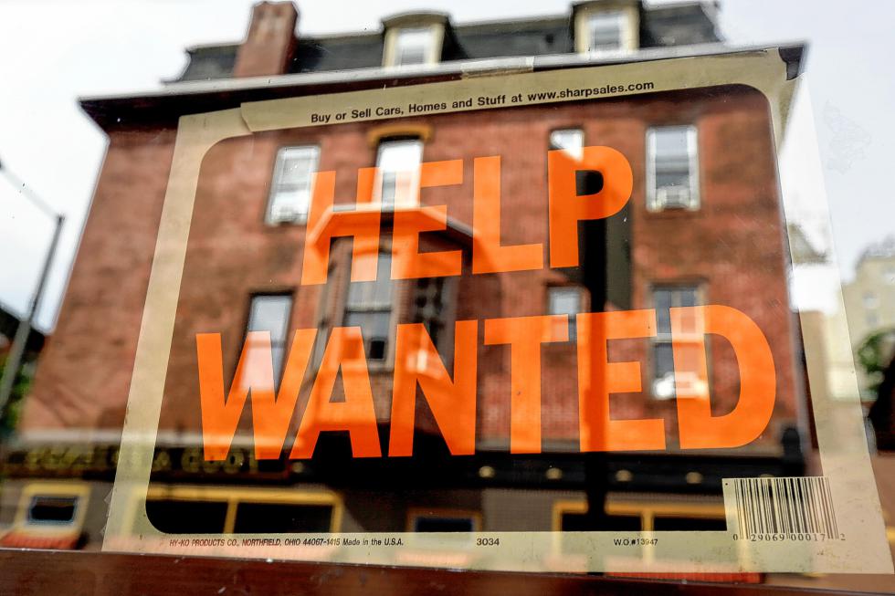FILE - In this Aug. 19, 2013 file photo, a Philadelphia business displays a help wanted sign in its storefront. The September jobs report coming Friday, Oct. 2, 2015, will provide clues to the job markets health that go beyond the unemployment rate. (AP Photo/Matt Rourke, File) - Matt Rourke | AP