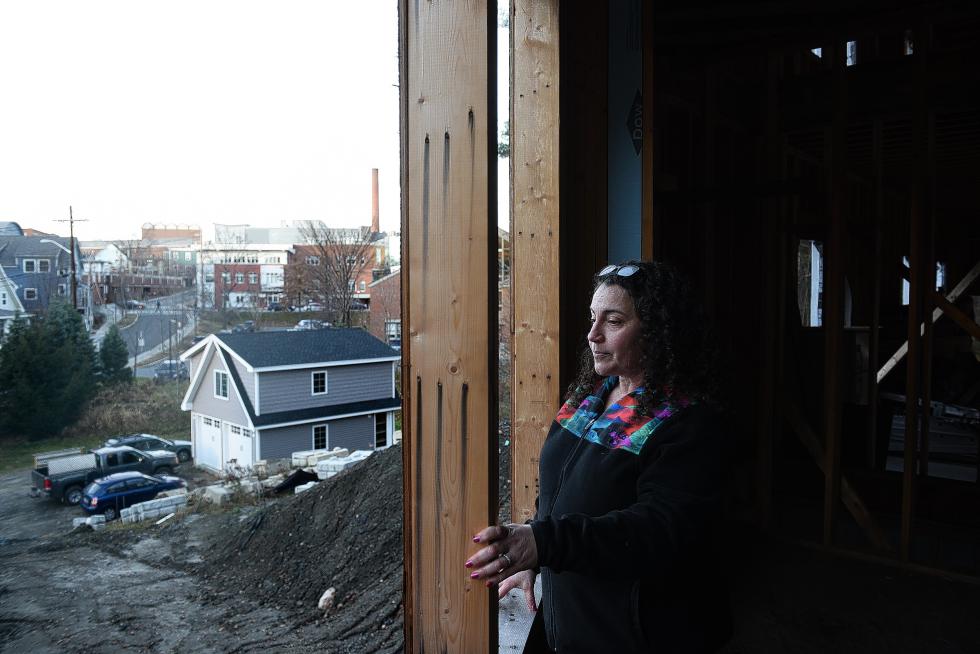 In 2002, Jolin Kish bought a small cape on a lot in Hanover that stretched from Ledyard Lane to Currier Place. Since then, she subdivided the lot and moved the cape to frontage on Currier Place and is building a 10,000 square foot house where she plans to live with her children, her divorced parents and her grandmother, on .35 acres with frontage on Ledyard Lane, a plan that has drawn concern from neighbors. Wednesday, November 18, 2015.  (Valley News - James M. Patterson) Copyright Â© Valley News. May not be reprinted or used online without permission. Send requests to permission@vnews.com. - James M. Patterson | Valley News