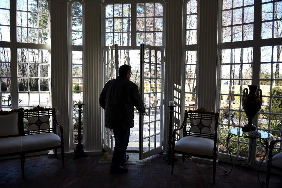 Co-owner of the Sumner Mansion in Hartland, Vt., Ken Lucci steps out to the renovated patio at the mansion on November, 18, 2015.  (Valley News - Jennifer Hauck) Copyright © Valley News. May not be reprinted or used online without permission. Send requests to permission@vnews.com. - Jennifer Hauck | Valley News