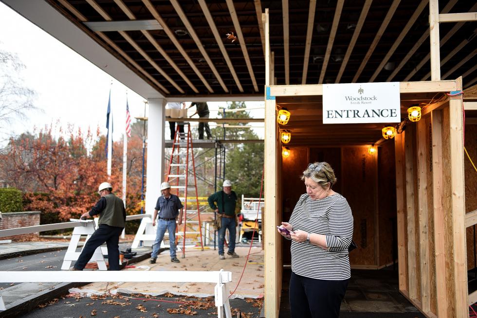 Margherita Verani, of Londonderry, N.H., checks her phone while waiting for her car at the Woodstock Inn & Resort on Nov. 6, 2015. Verani had been attending a real estate meeting with her husband at the inn. Renovations have begun at the inn in Woodstock, Vt. (Valley News - Jennifer Hauck) <p><i>Copyright © Valley News. May not be reprinted or used online without permission. Send requests to permission@vnews.com.</i></p> - Jennifer Hauck | Valley News