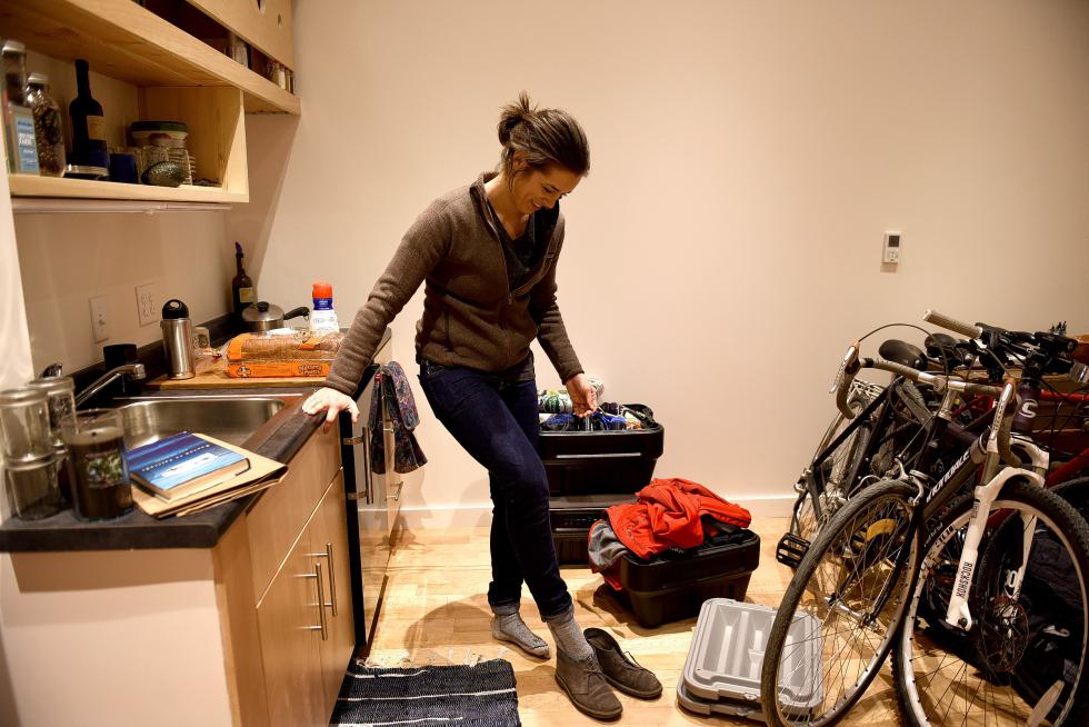 Blaire Campbell takes her shoes off in her new apartment in White River Junction, Vt., after getting home from work on December, 4, 2015. Campbell and her fiance had moved in a few days earlier. They are hoping to someday live in a tiny house and thought the small apartment would be a good way to start. (Valley News - (Jennifer Hauck) Copyright © Valley News. May not be reprinted or used online without permission. Send requests to permission@vnews.com. - Jennifer Hauck | Valley News