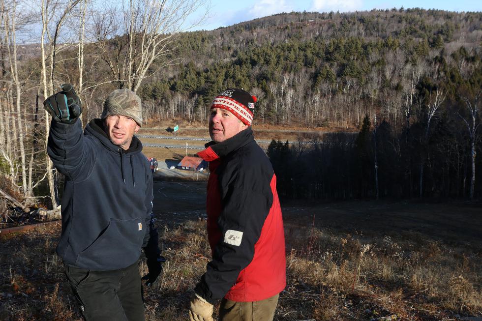 Whaleback Mountain Manager Gerd Riess, of Thetford, Vt., right, and facilities employee Eric Murphy, of Enfield, N.H., talk about what is left to complete an electrical upgrade at the Enfield ski slope on December 19, 2015. The mild weather has extended time for infrastructure projects. (Valley News - Geoff Hansen)<p><i>Copyright © Valley News. May not be reprinted or used online without permission. Send requests to permission@vnews.com.</i></p> - Geoff Hansen | Valley News