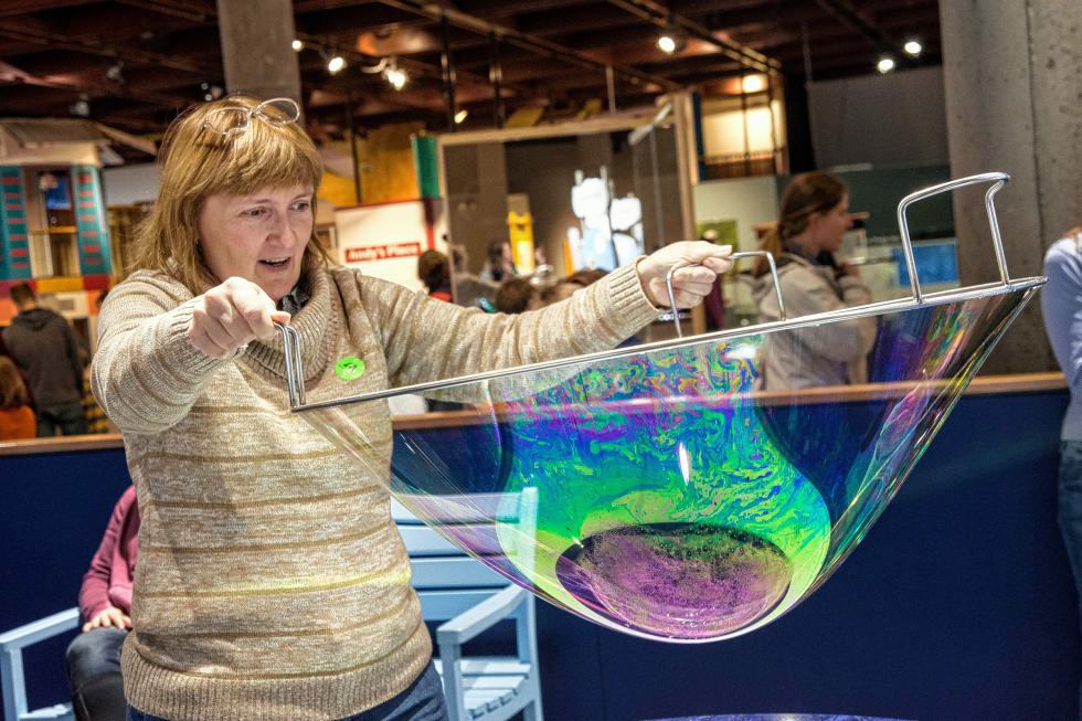 Oksana Pekker, of Plainfield, explores the science of bubbles during the Montshire Museum of Science's 40th anniversary celebration on Jan. 10. "You get to feel like you are 5 years old again," said her husband, Leonid. Nancy Nutile-McMenemy photograph (www.photosbynanci.com) - Nancy Nutile-McMenemy |