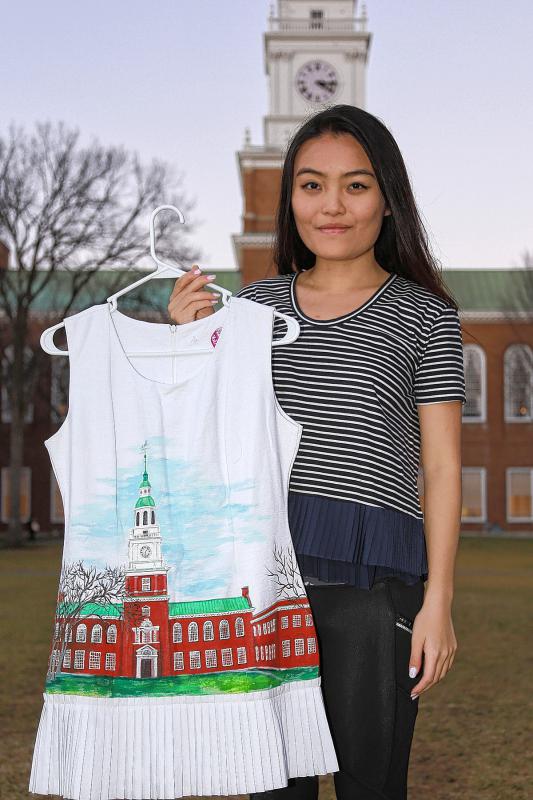 May Nguyen, a sophomore at Dartmouth College, holds one of her hand-painted dresses. Nguyen recently won a "pitch" contest hosted by the Neukom Digital Arts, Leadership, & Innovation Lab and the Dartmouth Entrepreneurial Network Innovation Center. Gloria Towne photograph - Gloria Towne |