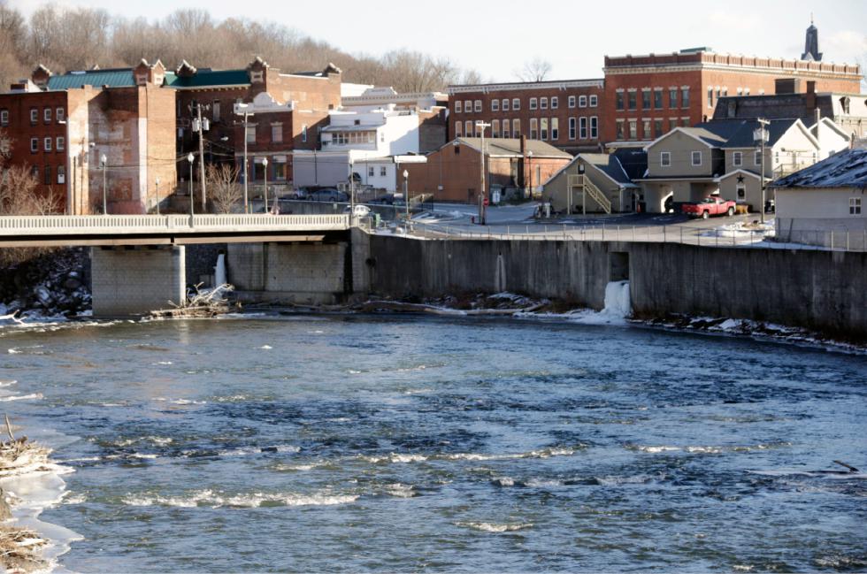 In this Thursday, Jan. 21, 2016 photo, the Hoosic River runs through the village of Hoosick Falls, N.Y. Federal regulators have warned residents of the upstate New York factory village near the Vermont border not to drink water from municipal wells, and a plastics plant has agreed to supply bottled water and pay for a new filtration system. (AP Photo/Mike Groll) - Mike Groll | AP