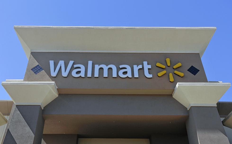 This Sept. 19, 2013, photo, shows the sign of a Wal-Mart store in San Jose, Calif. A National Labor Relations Board judge says Wal-Mart Stores Inc. unlawfully disciplined workers who staged protests in May and June of 2013 and ordered the retailer to reinstate 16 former employees, as well as give them back pay. The decision, posted on the labor boards website late Thursday, Jan. 21, 2016, arrived one day after the nations largest private employer said it was giving raises to most of its hourly employees. (AP Photo/Jeff Chiu) - Jeff Chiu | AP